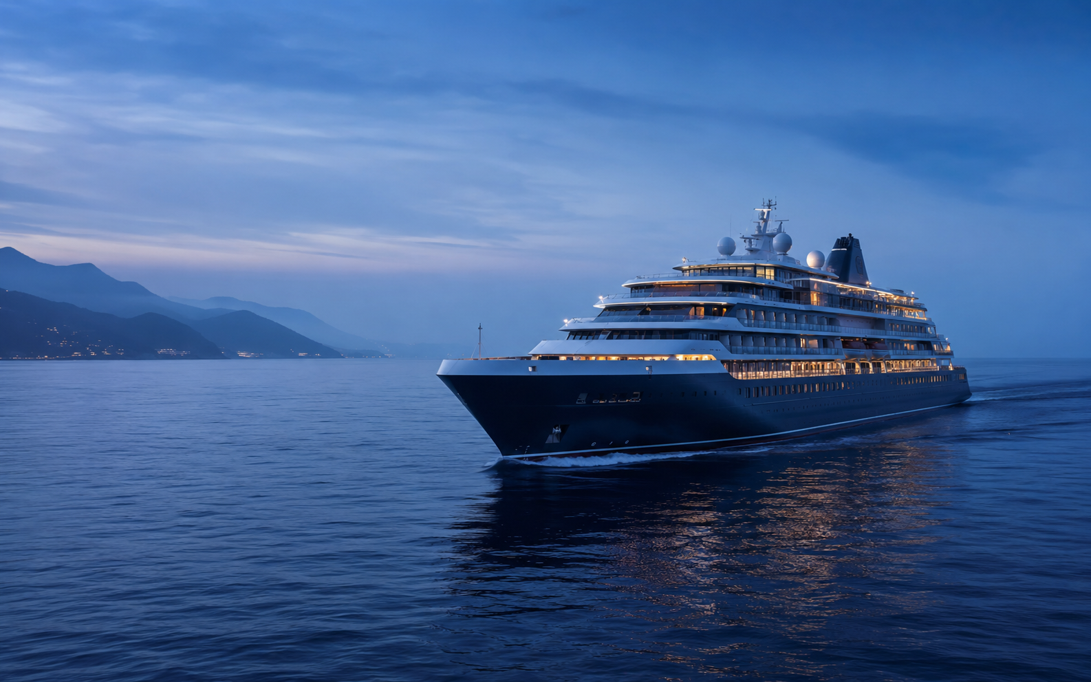 Luxury cruise ship at twilight for an Oceania Cruises and Viking Ocean comparison