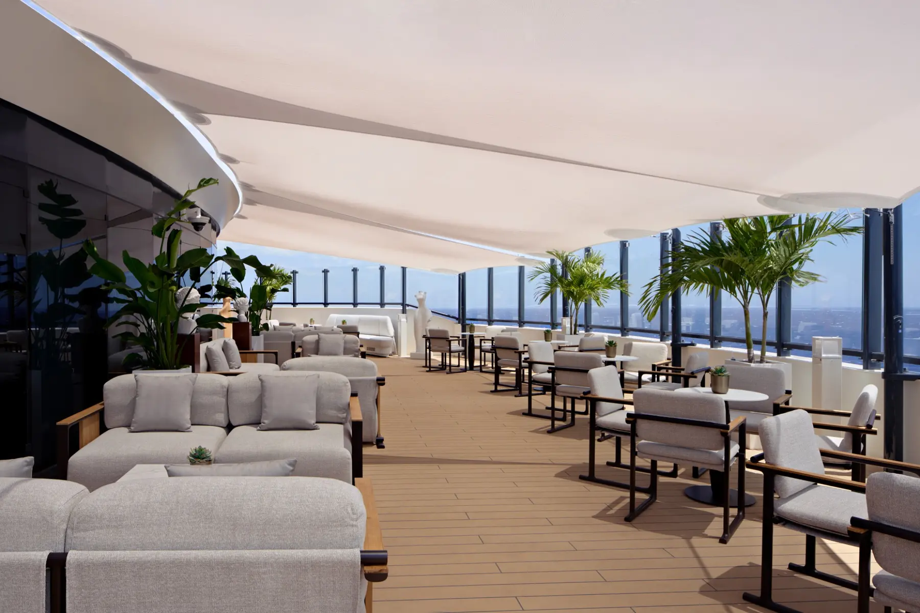 Outdoor seating at The Art Bar aboard Luminara