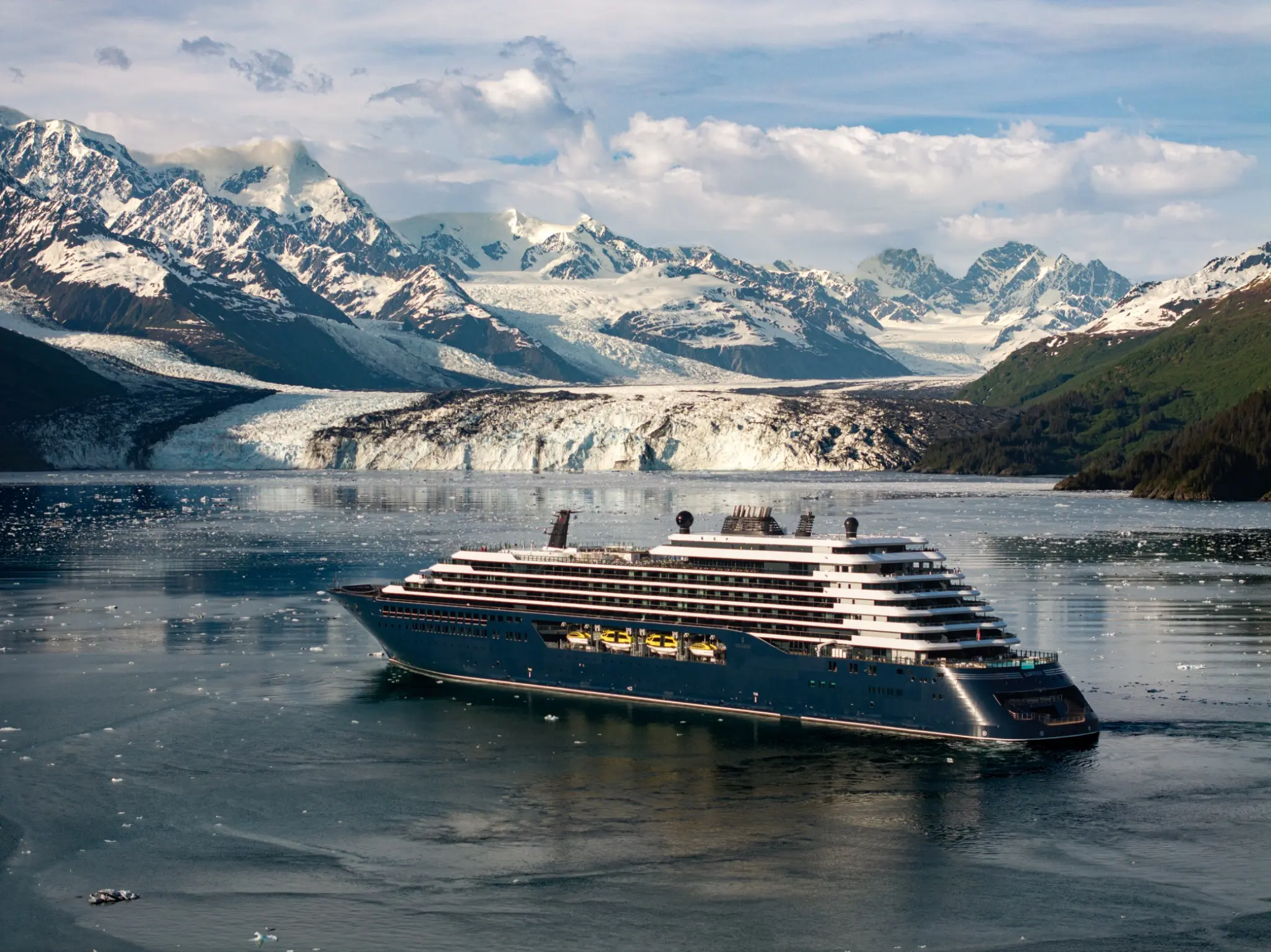 Luminara from The Ritz-Carlton Yacht Collection sailing in Alaska near a glacier