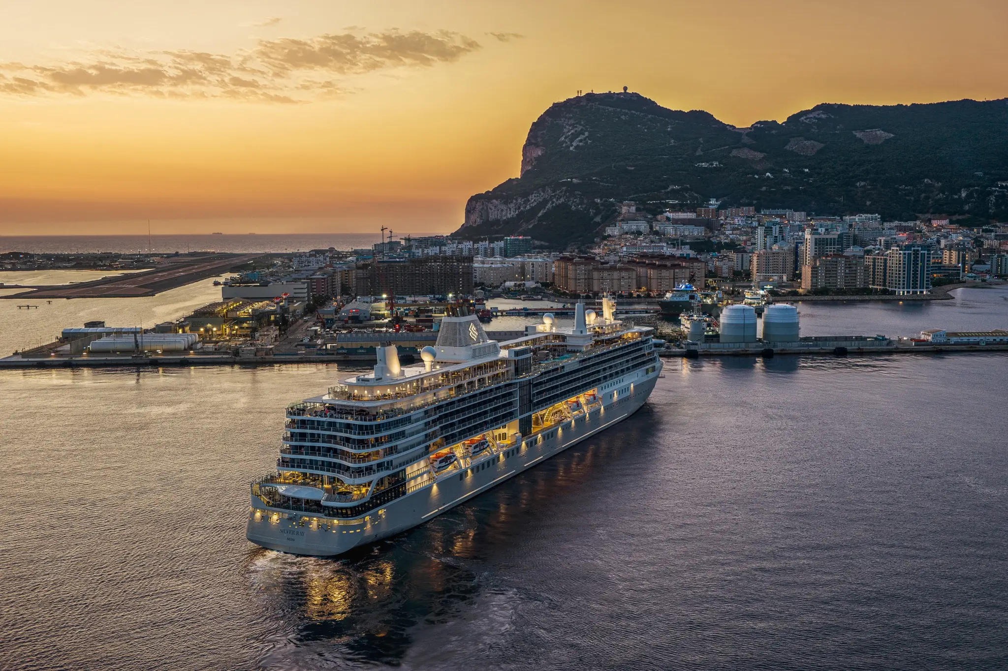 Silversea luxury cruise ship sailing past Gibraltar at sunset